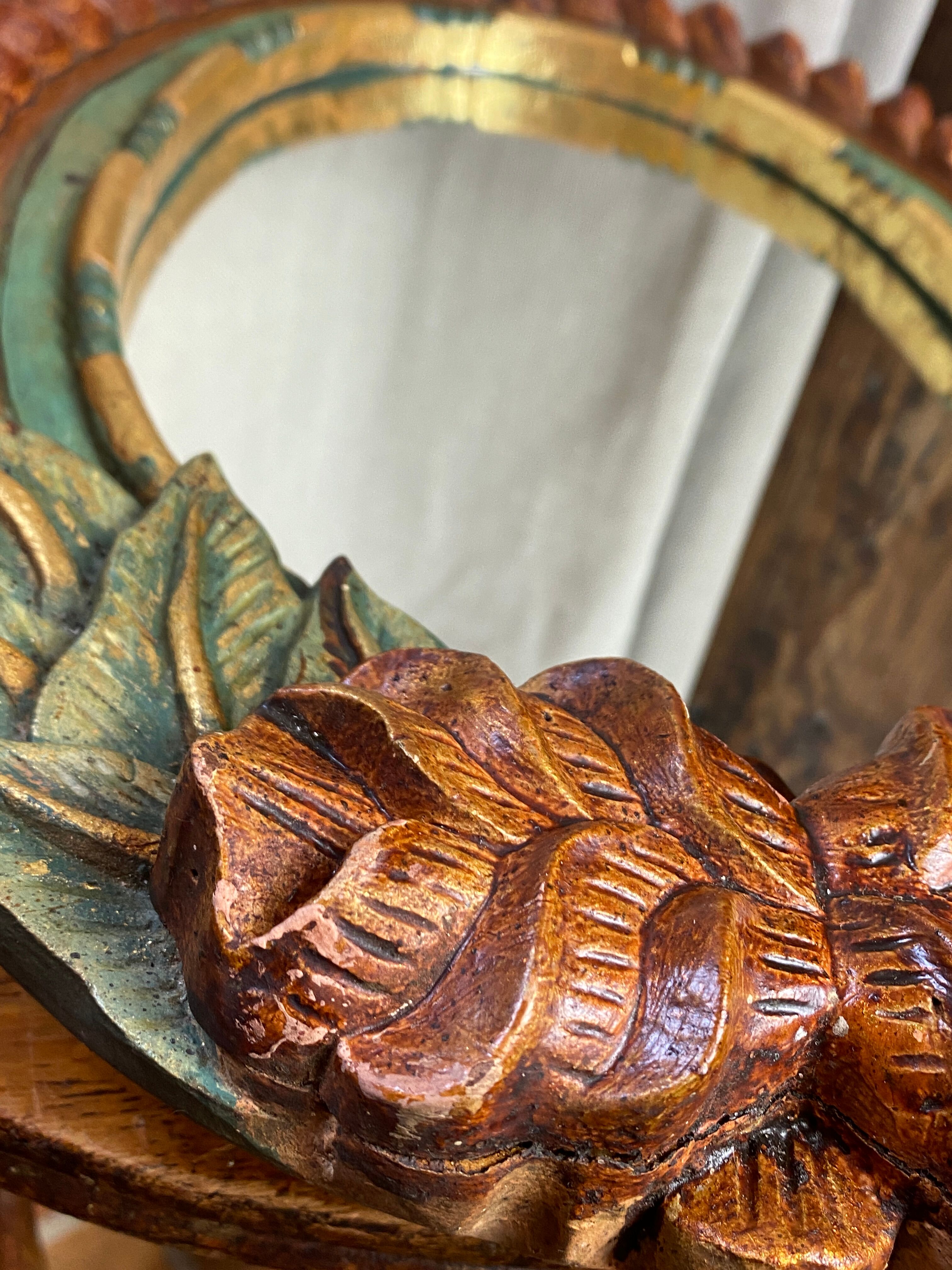 Oval mirror in carved wood