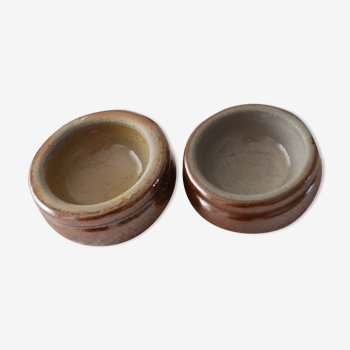 Two sandstone butter makers