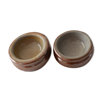 Two sandstone butter makers