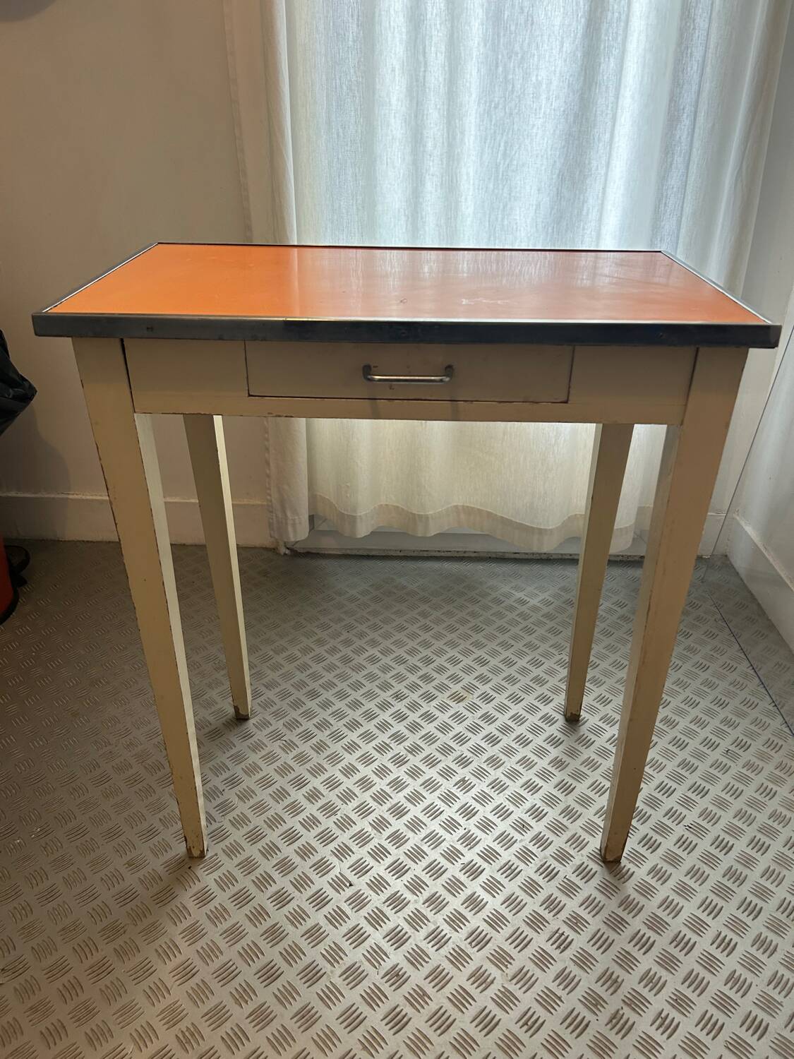 Orange wood and formica table