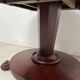 Empire style round table with claw feet, 19th century.