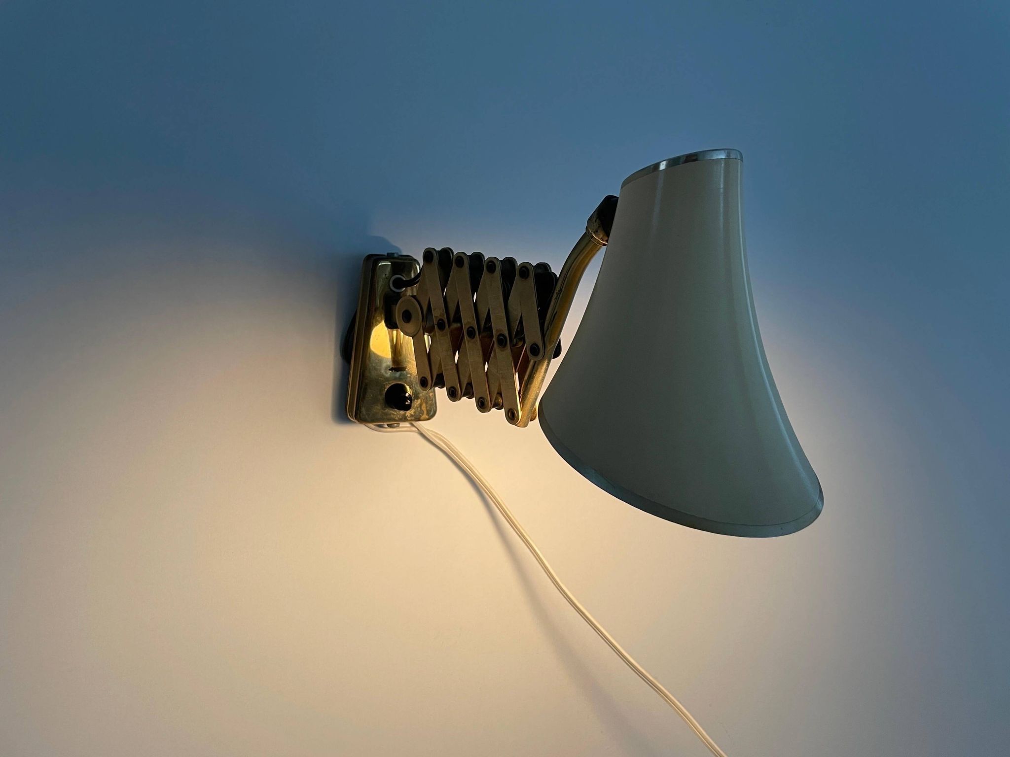 Cream metal and brass wall lamp with scissors design by Karl Lang for SIS Licht, 1950s, Germany.