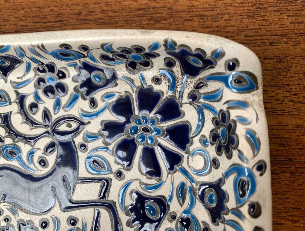 Vintage handmade blue ceramic ashtray with deer and flower ornament from Rodos Ceramics.