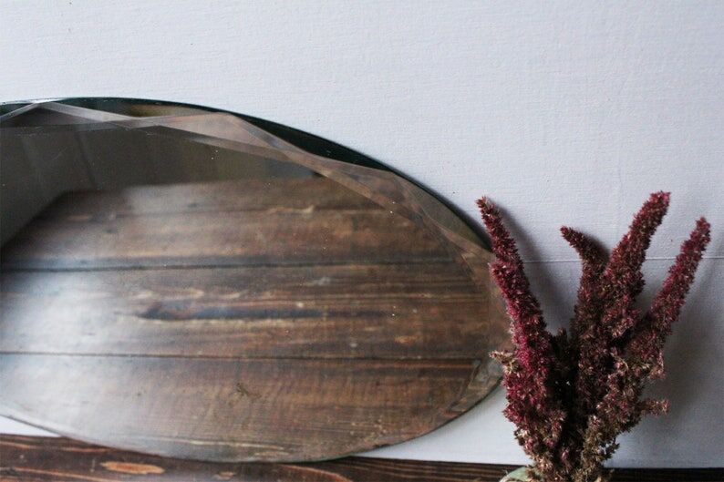 Old oval beveled art deco mirror