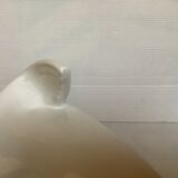 White earthenware sea lion in piggy bank