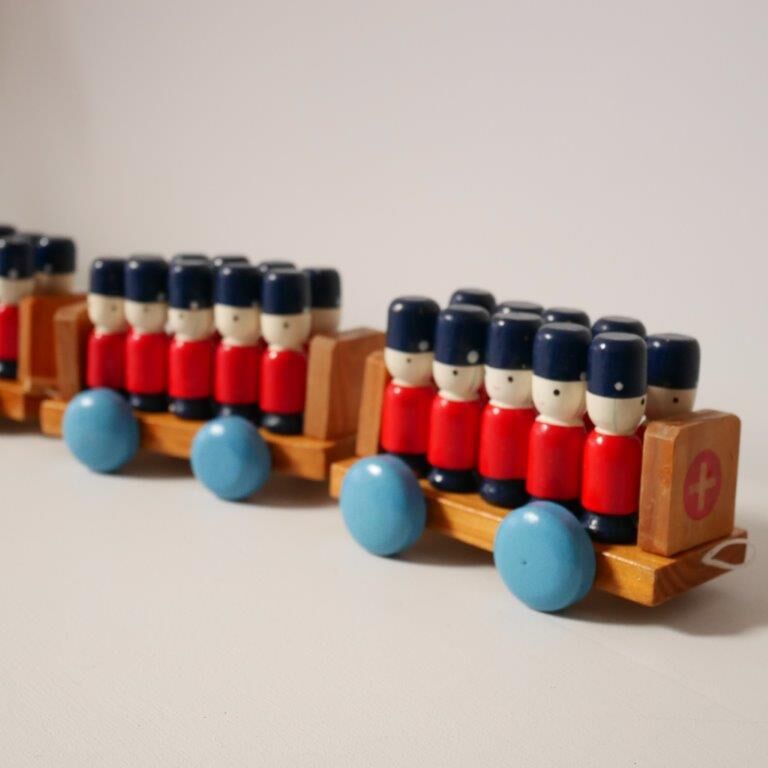 Wooden train with soldiers