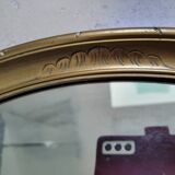 Oval mirror in gilded stucco 45 cm