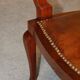 19th century armchair in leather and rosewood inlaid with brass and rosewood