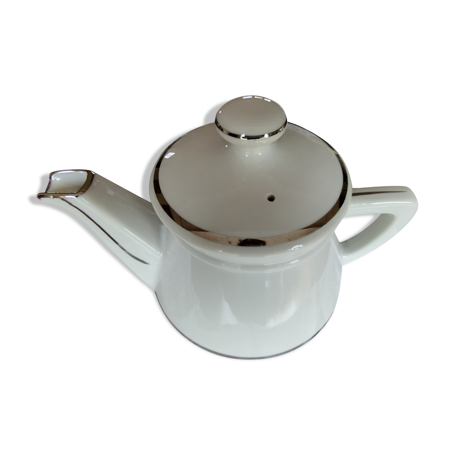 White and silver porcelain teapot