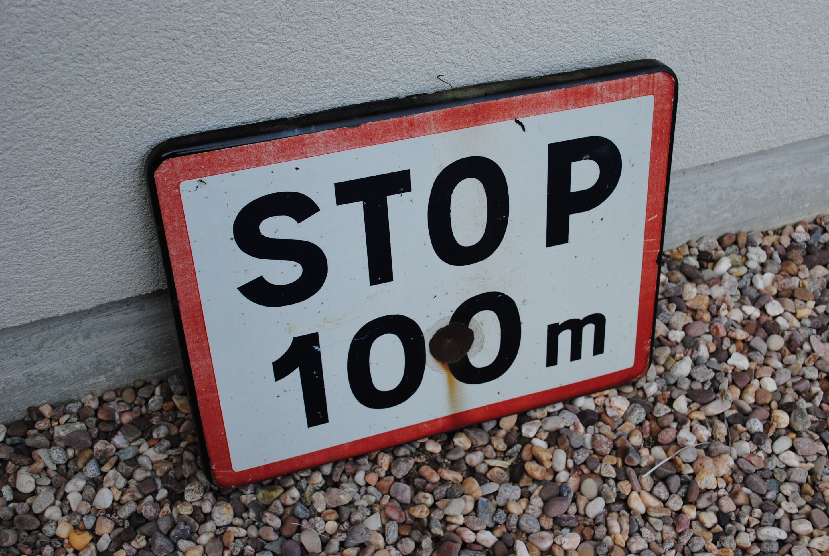 Enamelled sign Stop at 100 m