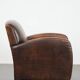 Beautifully shaped vintage sheepskin armchair with character
