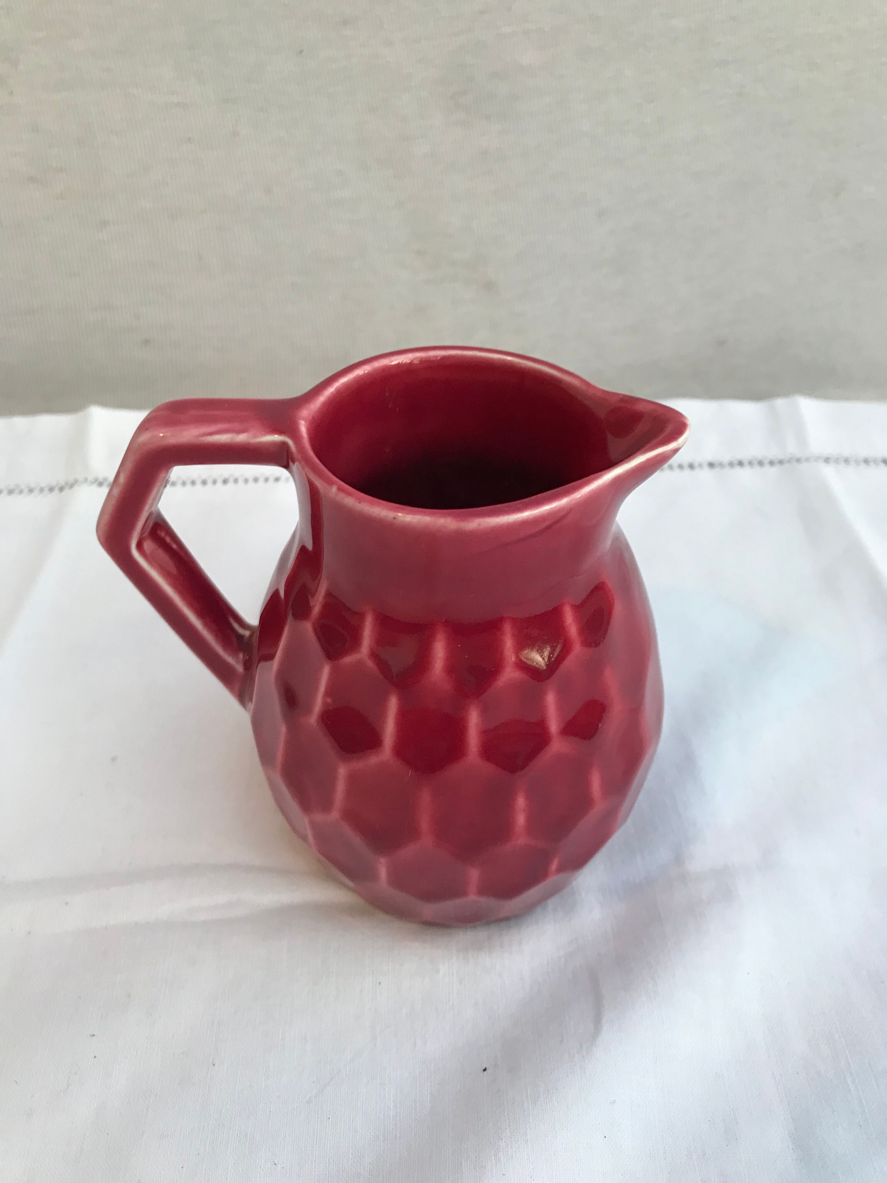 Former art deco red ceramics pitcher