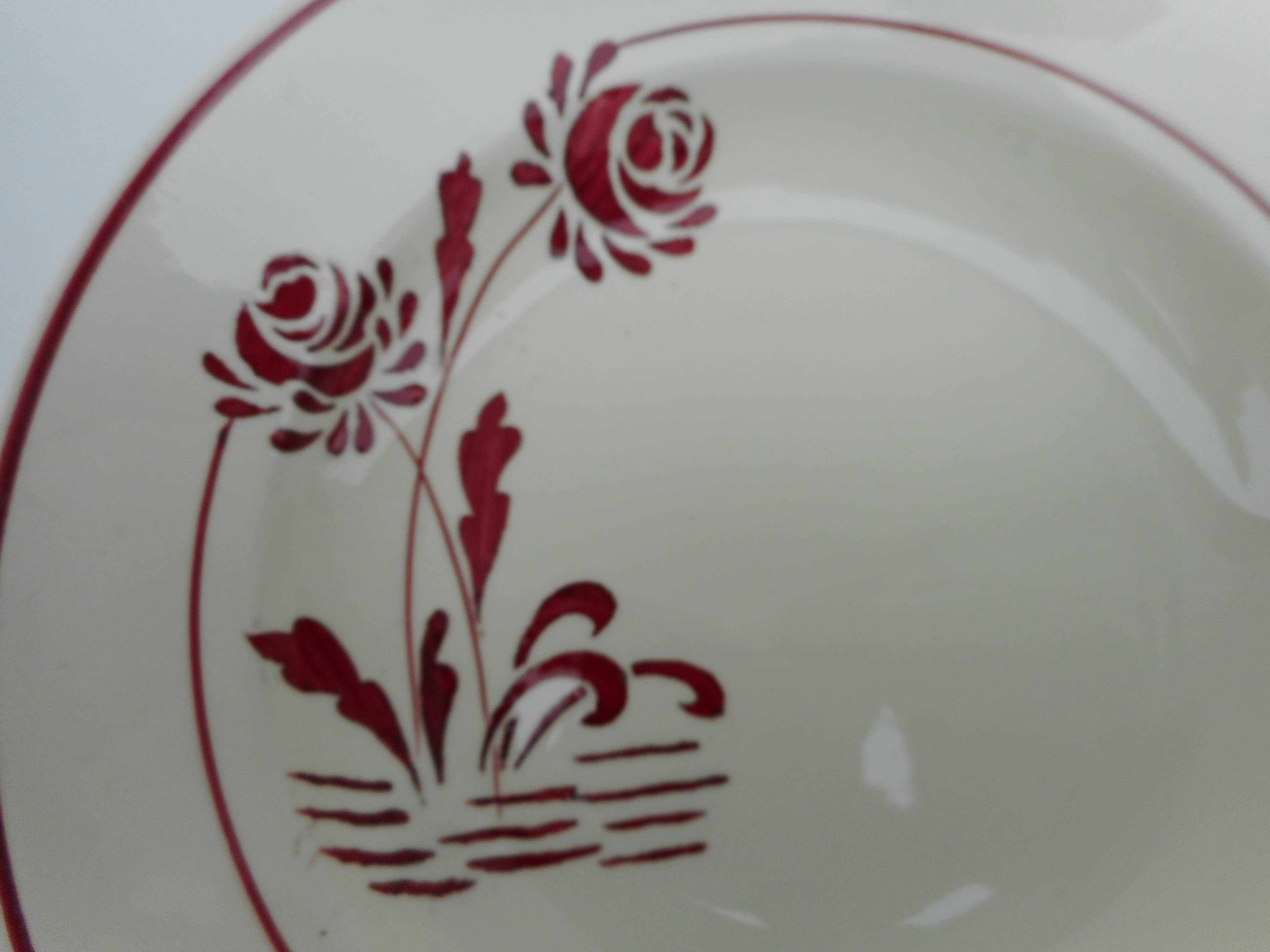 Six hollow earthenware plates