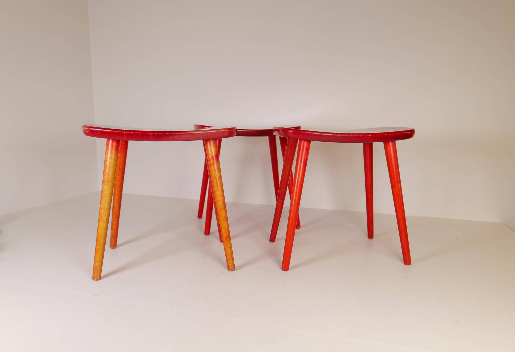 Swedish stools in red lacquered birch, Yngve Ekström "Palle", 1970s