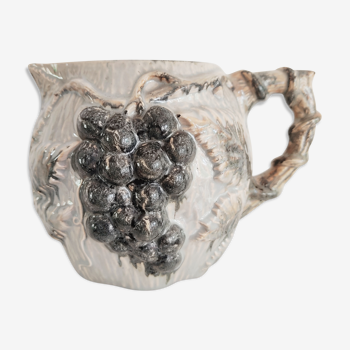 Pitcher bunches of grapes in relief