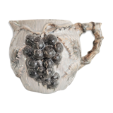 Pitcher bunches of grapes in relief