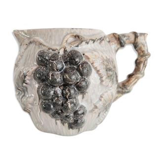 Pitcher bunches of grapes in relief