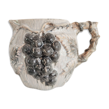 Pitcher bunches of grapes in relief