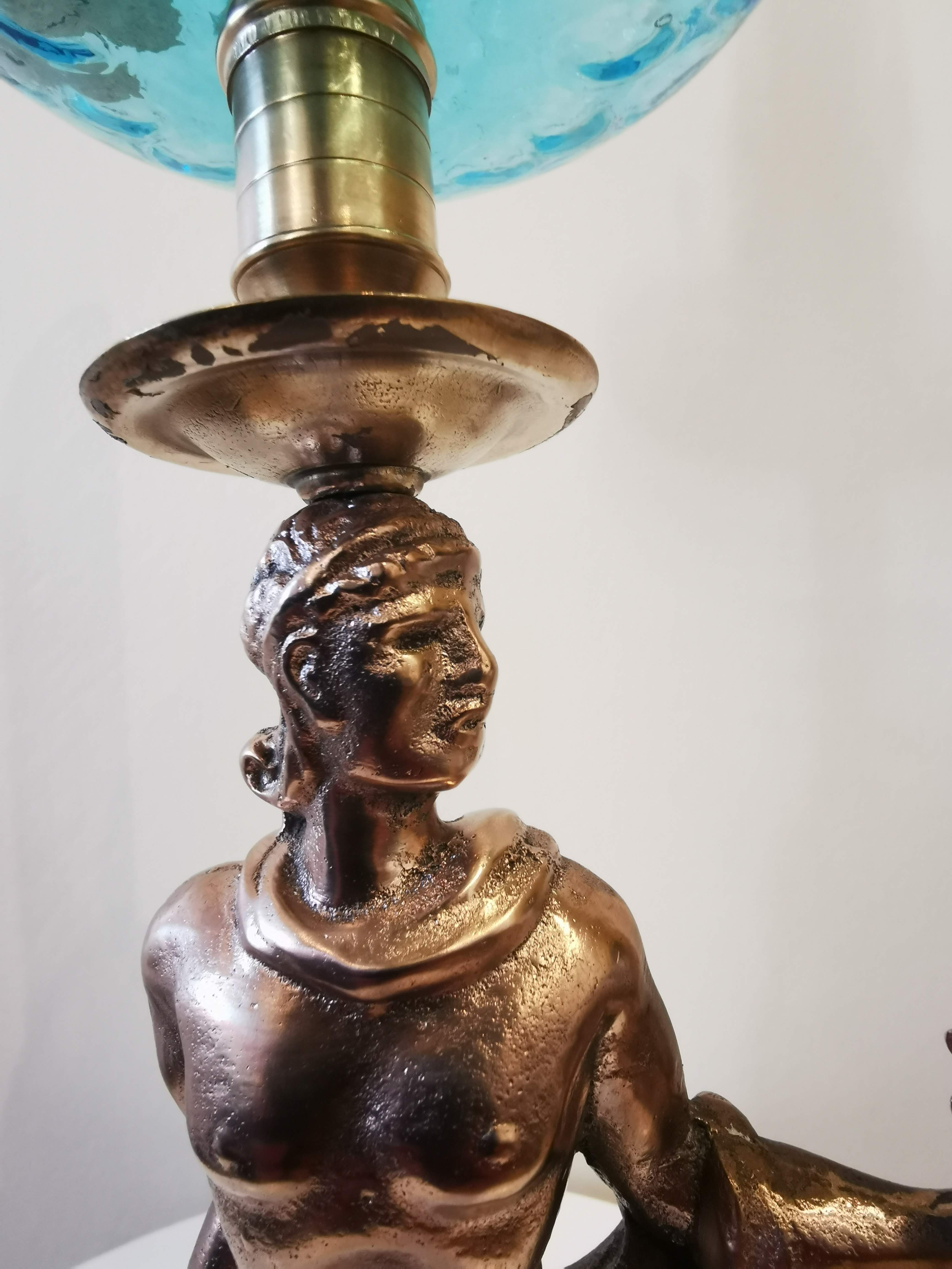 Large kerosene lamp mounted on bronze statue. Late nineteenth century