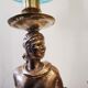 Large kerosene lamp mounted on bronze statue. Late nineteenth century