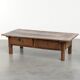 Table basse antique sud-européenne en bois fruitier avec un tiroir.