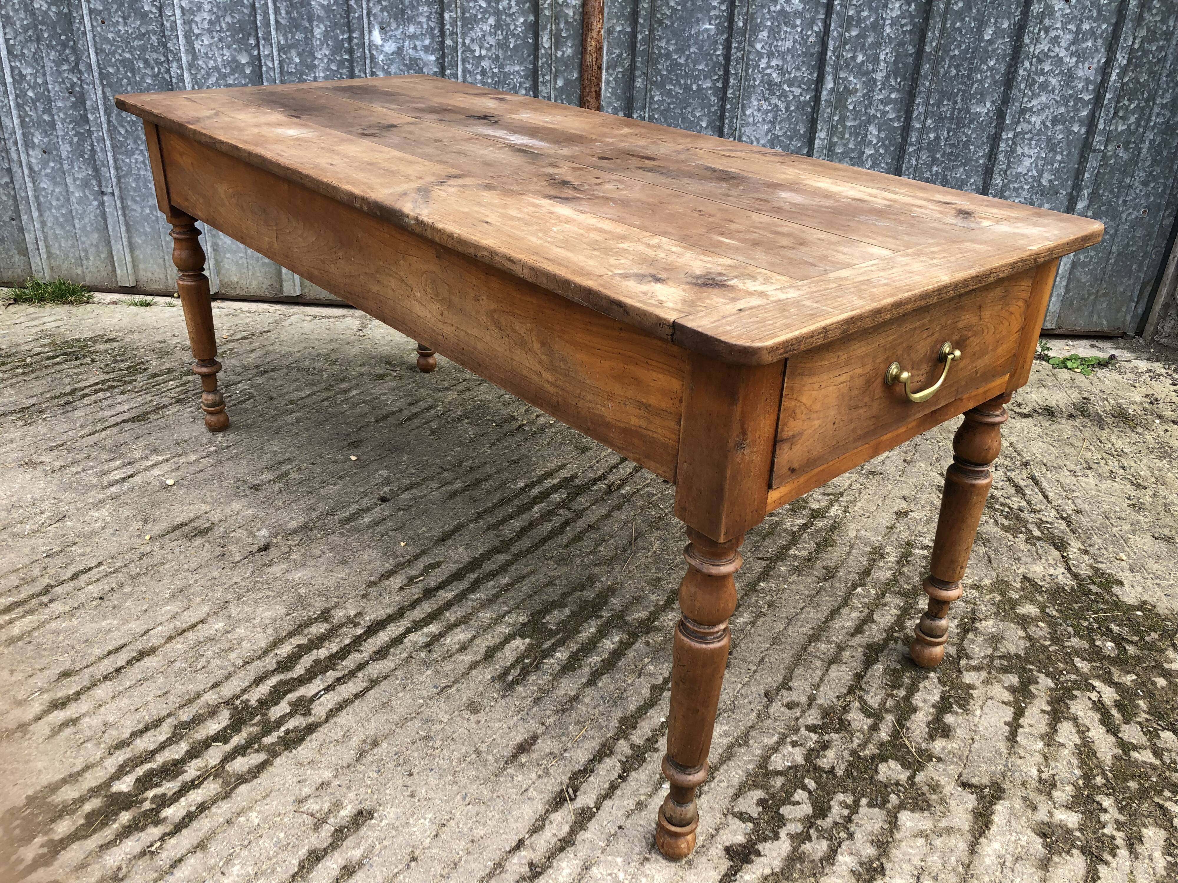 Antique cherry farmhouse table with 2 drawers and 1 pull-out