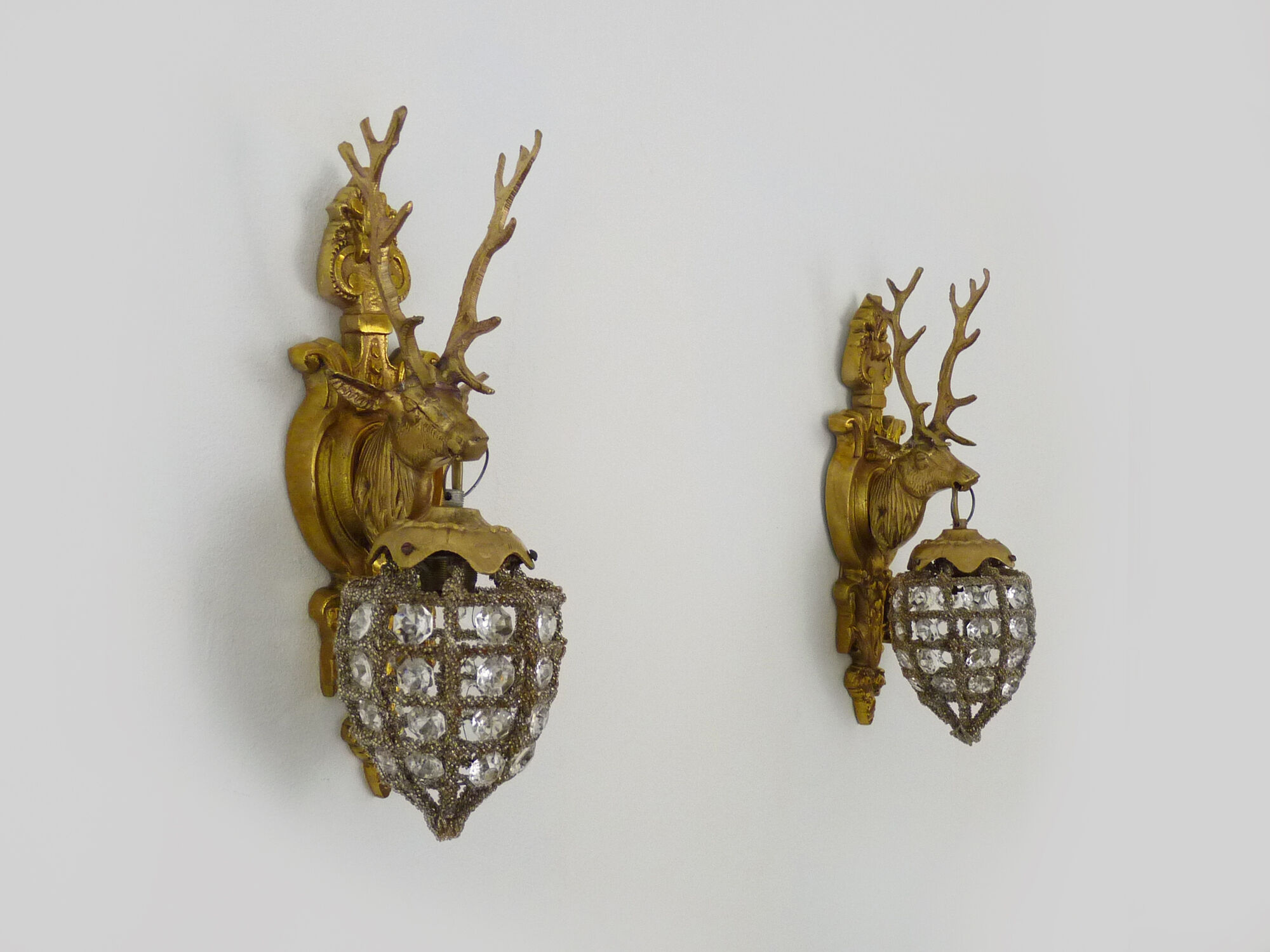 Pair of vintage wall lamps with pearl deer head and glass grapevines