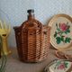 Small canister demijohn in glass circled with wicker - vintage