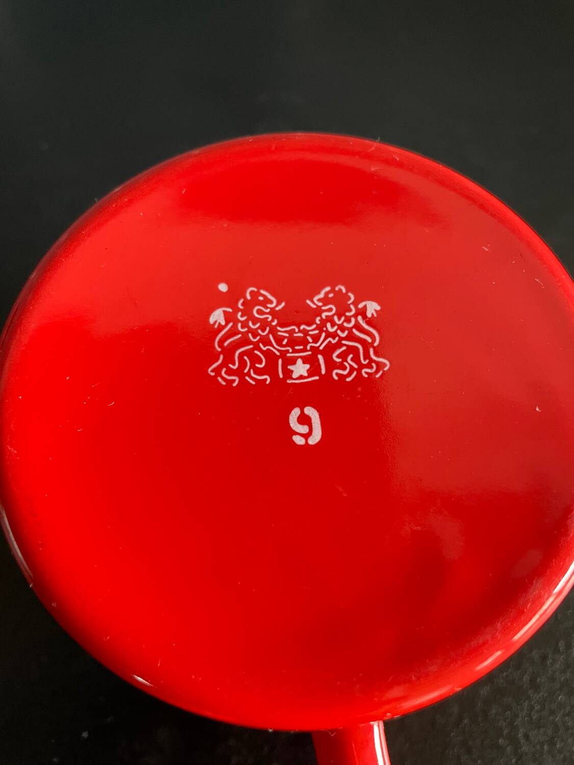 Red enameled sheet metal mug