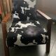 Armchair in walnut and animal print velvet