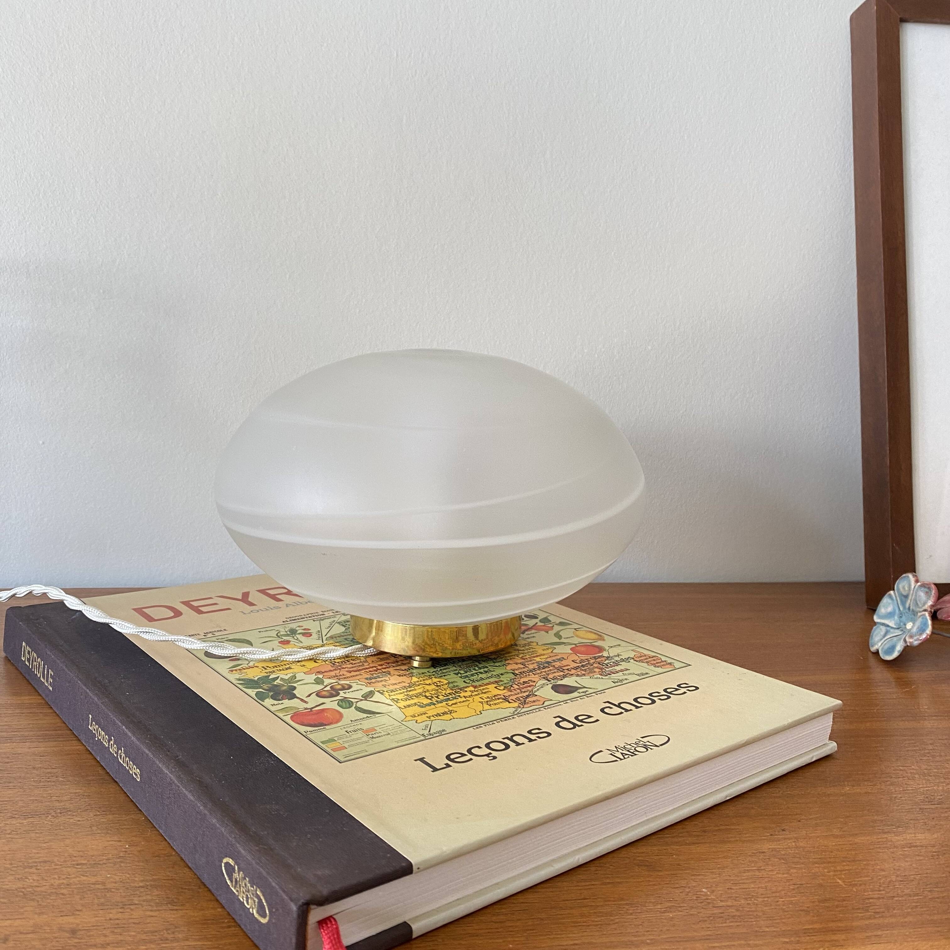 Vintage desk table lamp in antique glass with a brass base.