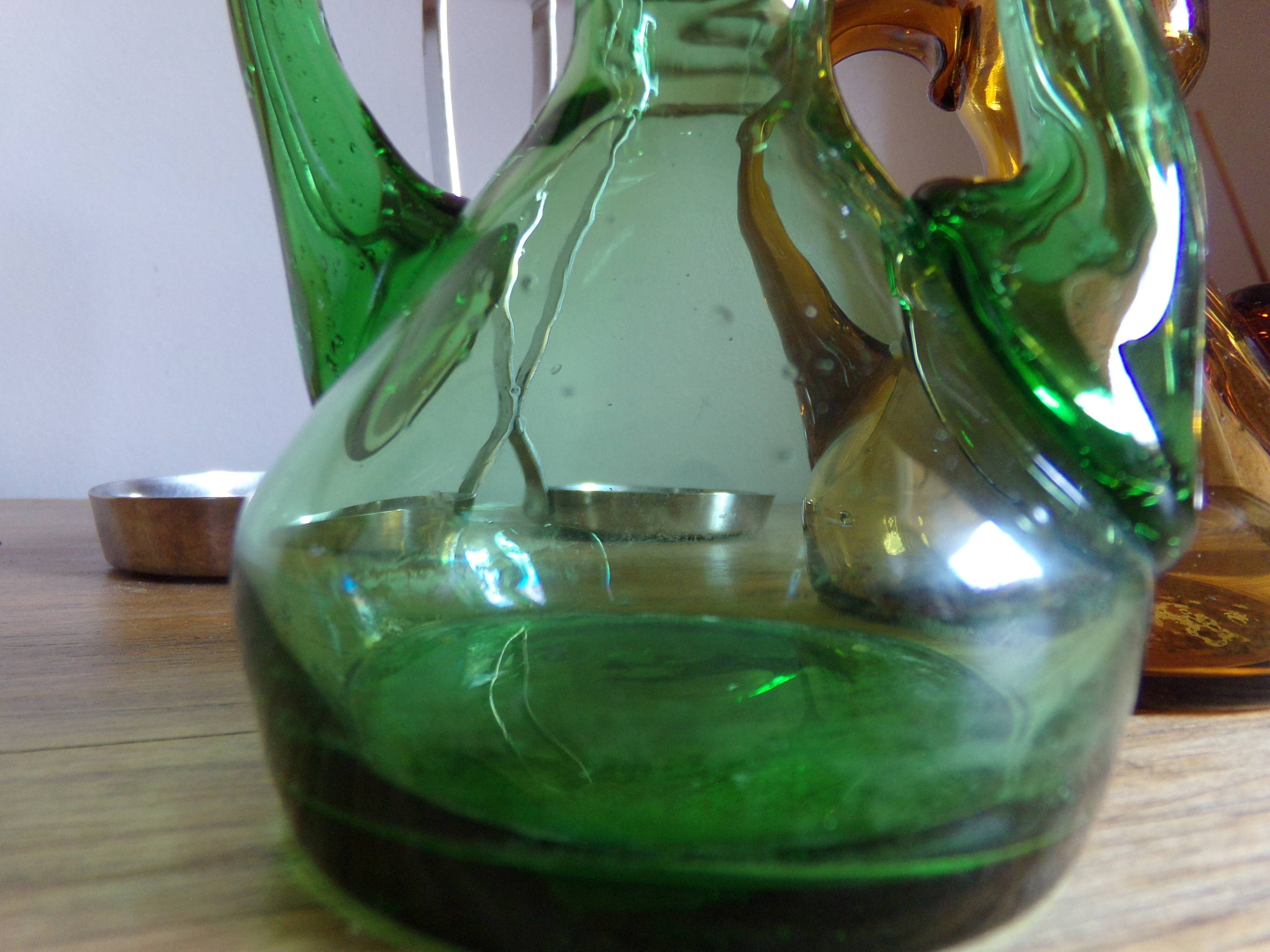 Oil and winery in amber and green sulphur glass