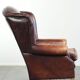 Comfortable cowhide wingback armchair in English style