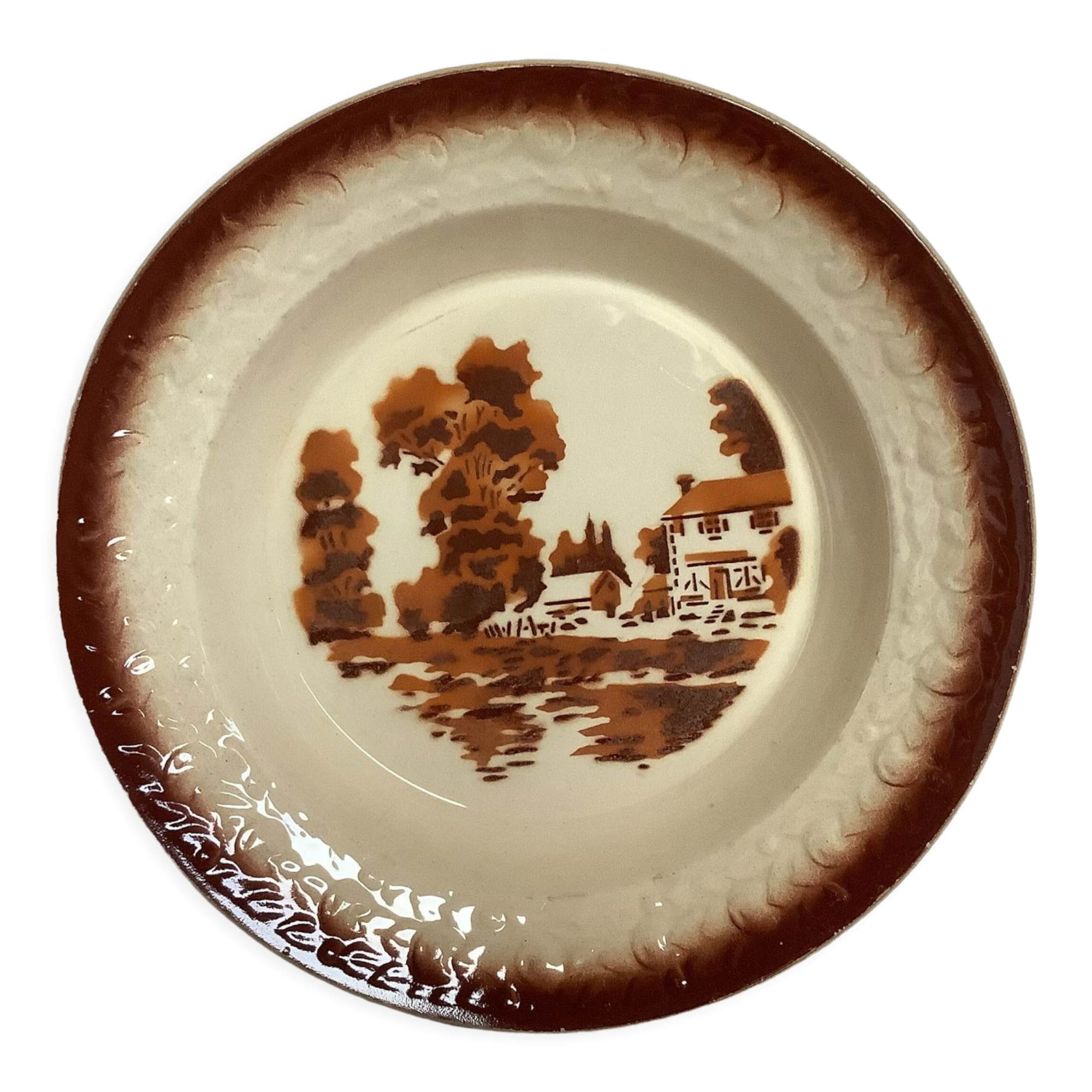 Earthenware plate from Moulin des Loups with stencil pattern.