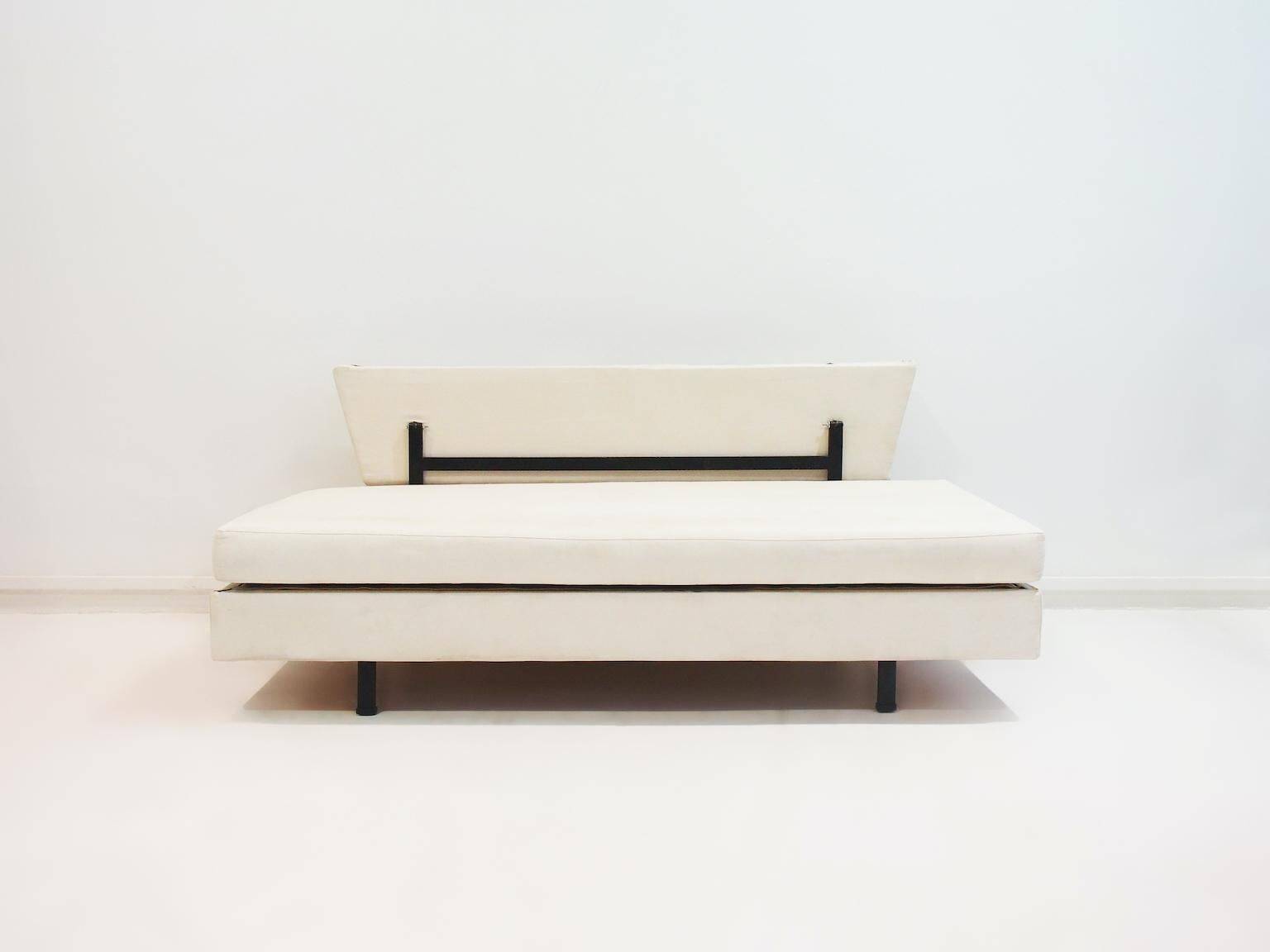 Italian modernist daybed with white upholstery and iron frame.