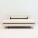 Italian modernist daybed with white upholstery and iron frame.