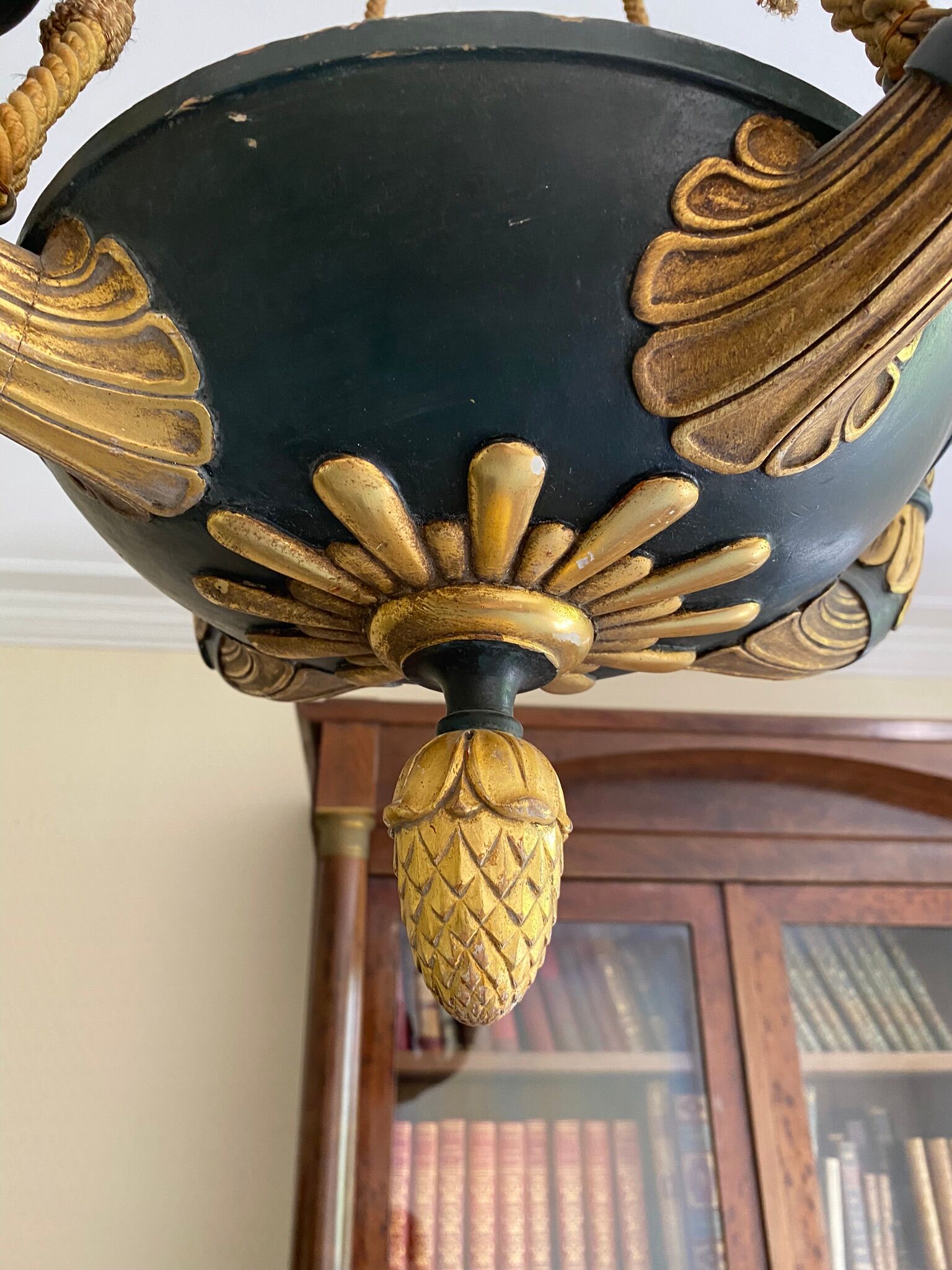 Empire style chandelier with four lights in sheet metal, bronze with patina and gilding
