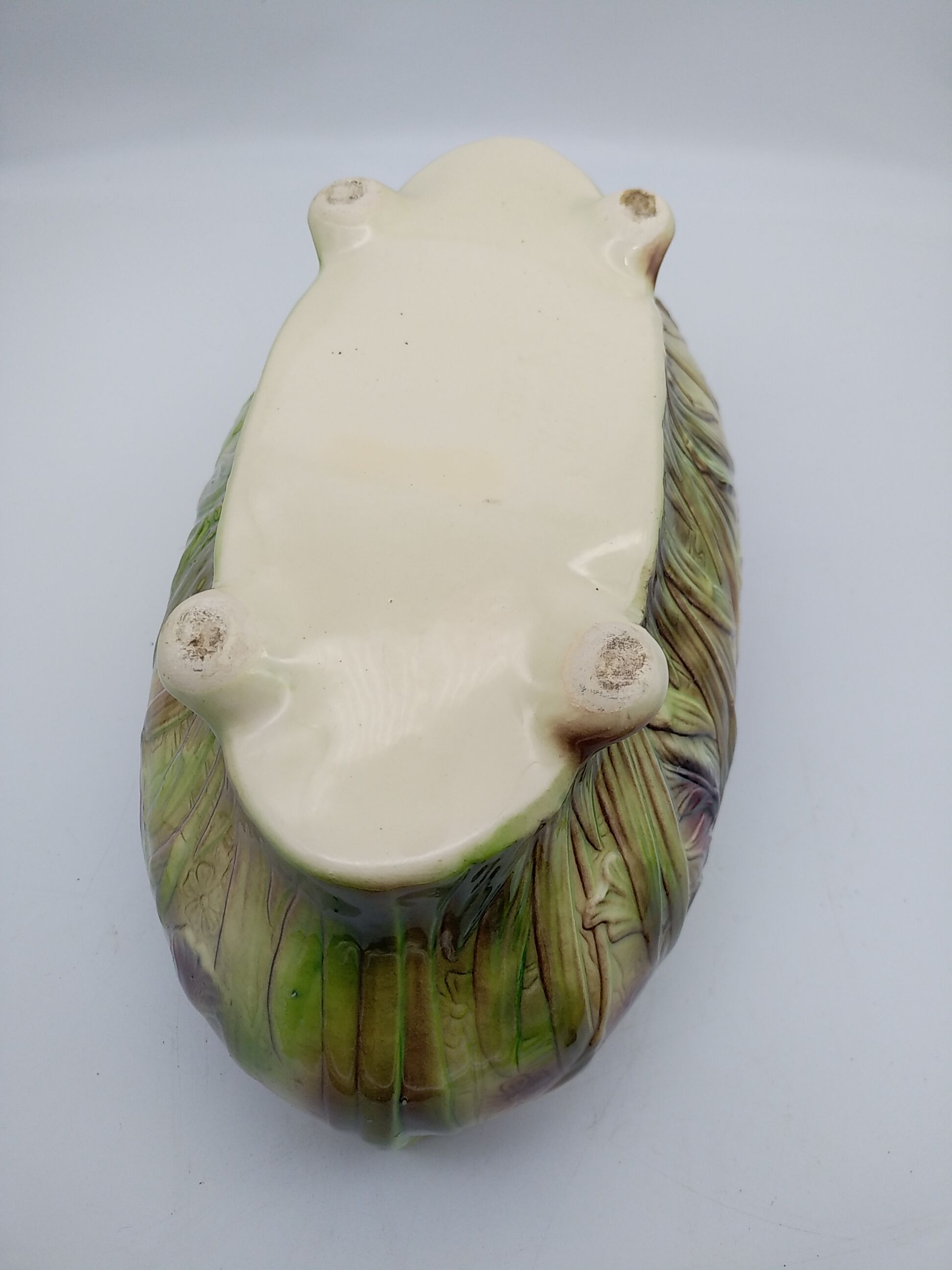 Saint Clement slurry planter with iris decoration.