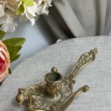 Bronze hand candlestick in the shape of a peacock