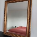 Miroir bois sculpté patine doré