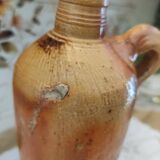 Old bottle in terracotta varnished finish