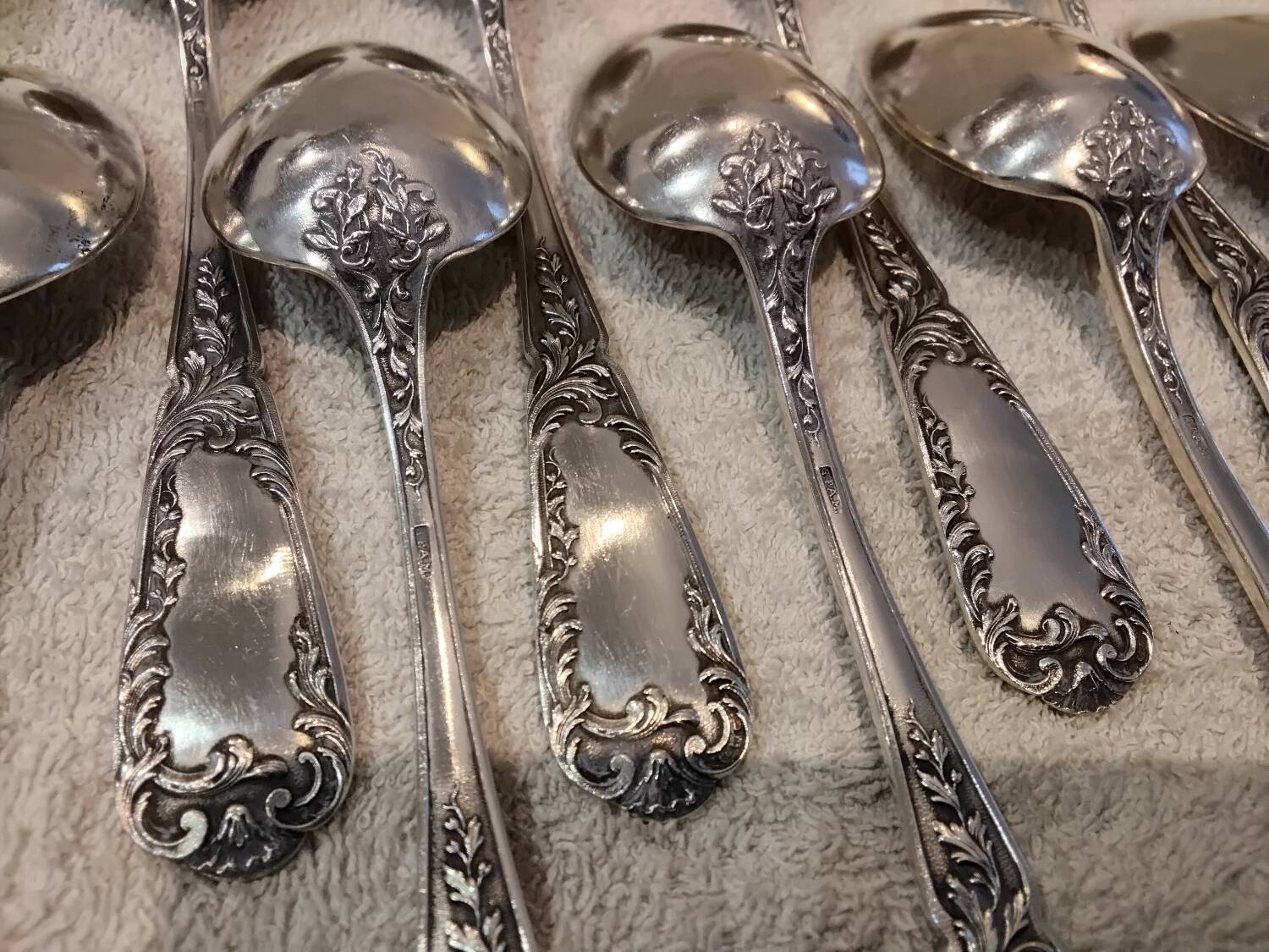 12 silver-plated metal dessert spoons, silversmith SFAM, rocaille design, 19.1 cm.