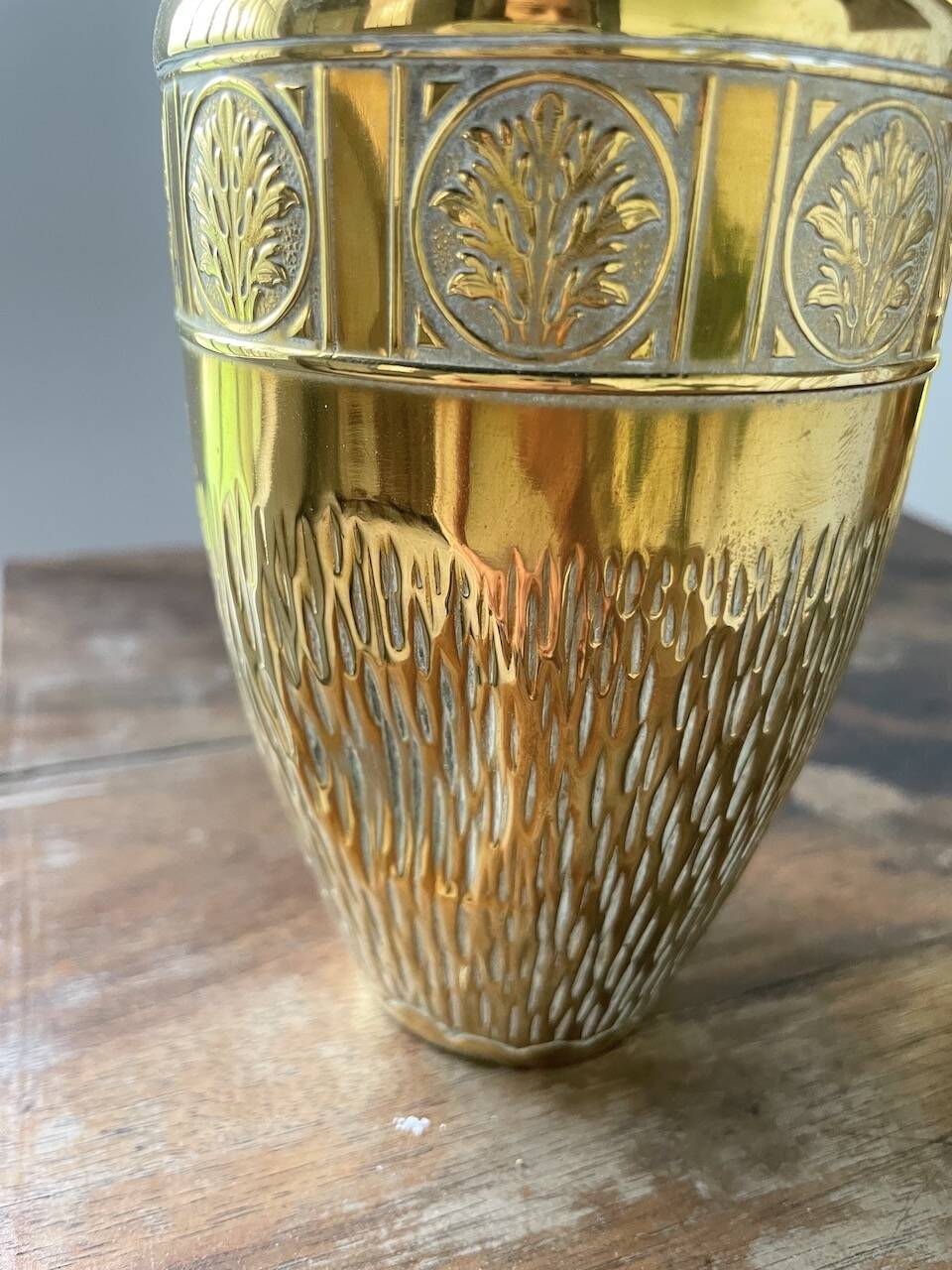 Duo of embossed brass vases