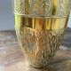 Duo of embossed brass vases