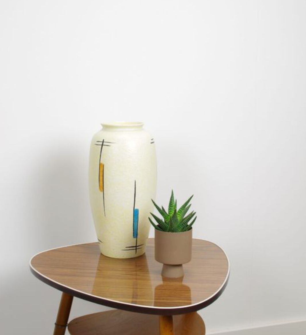 Vintage vase in light yellow porcelain