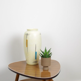 Vintage vase in light yellow porcelain