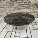 Round chrome coffee table with smoked glass