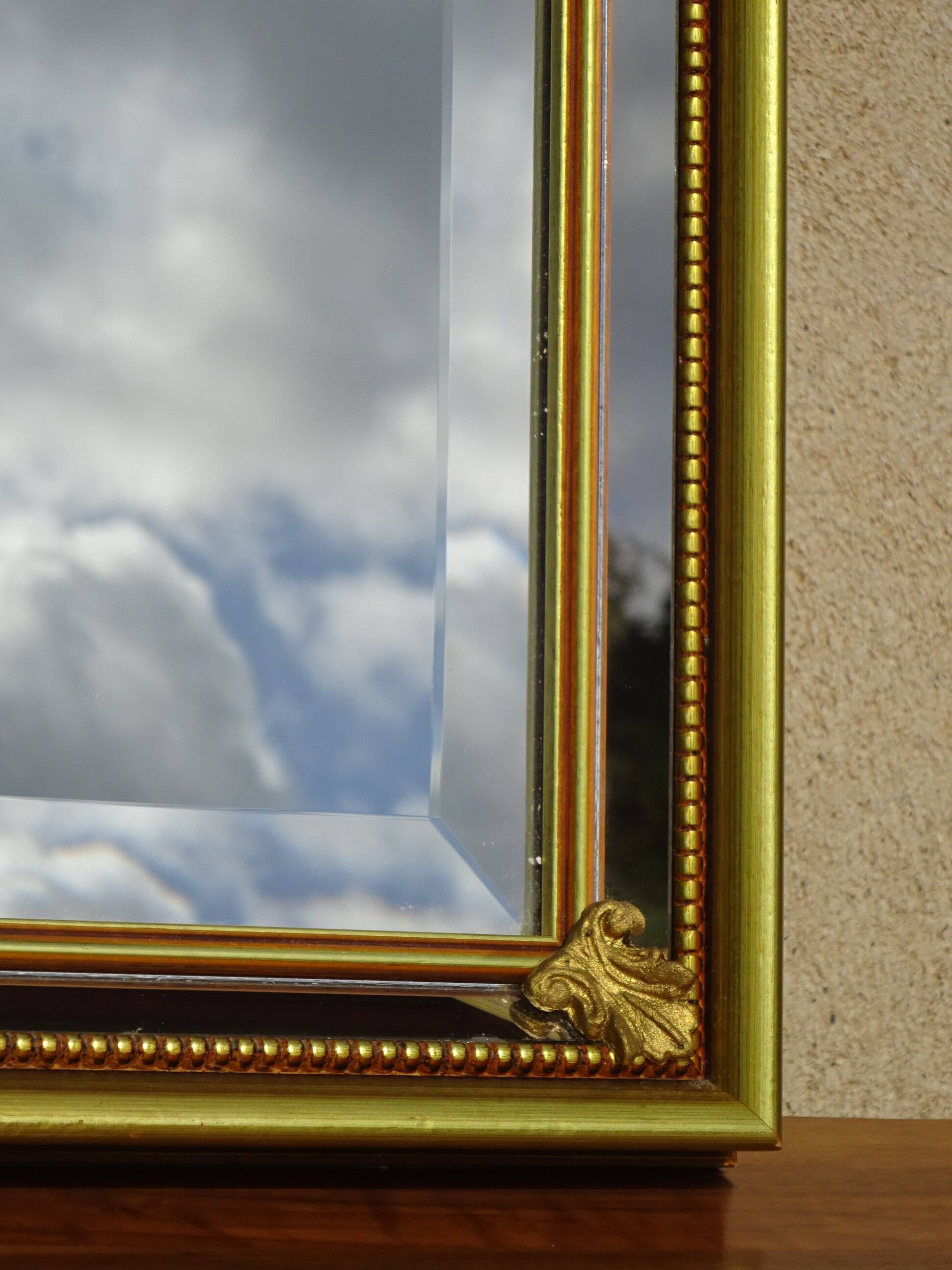 Hallway mirror, gilded frame, curtains and fleur-de-lis
