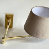 articulated brass and velvet wall light