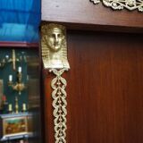 Empire style mahogany display bookcase with gilt bronze decoration and three doors.